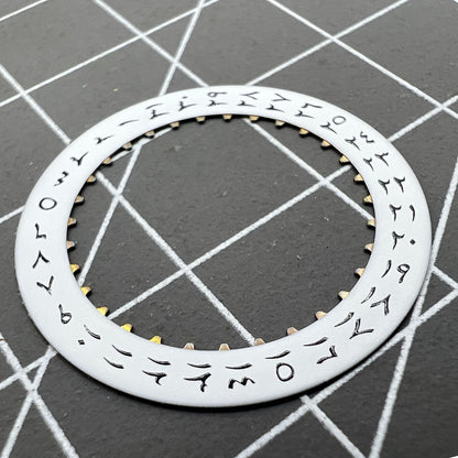 White background close-up of Arabic date disk wheel for ETA2824 Datejust watches, precision component.