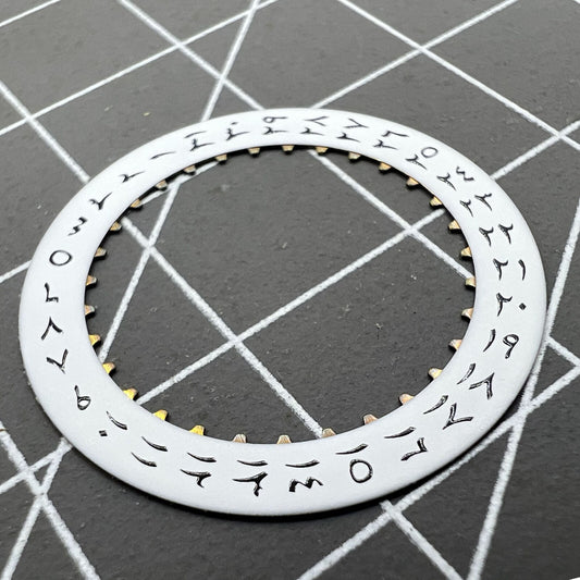 White background close-up of Arabic date disk wheel for ETA2824 Datejust watches, precision component.