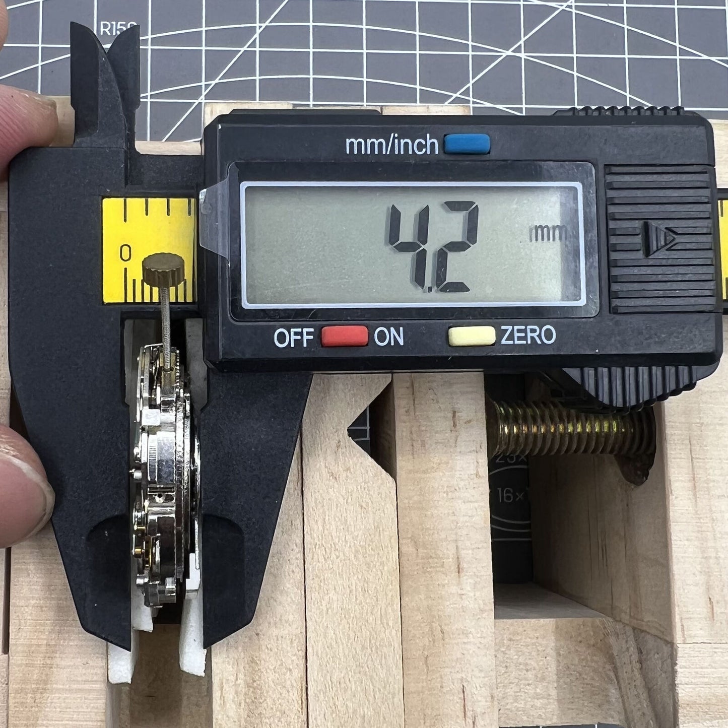 Automatic mechanical watch featuring reversed balance wheel and big date at 12 for precise timekeeping.