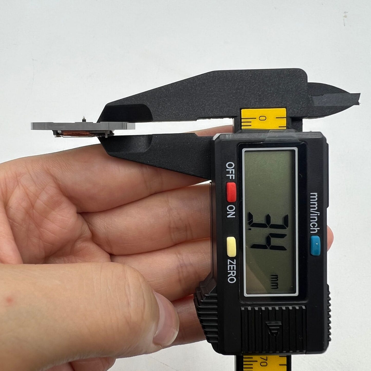 Miyota 2415 quartz movement with black date disk at 3 o'clock, Japan-made precision watch part.