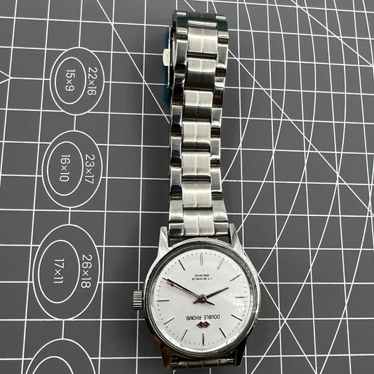 Beijing 31mm China-made manual mechanical watch with silver case and three hands, stylish and precise.