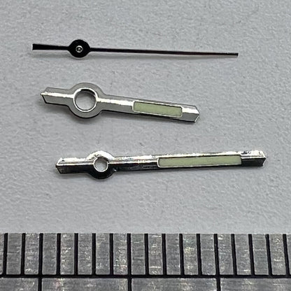 Silver luminous watch hands for Miyota 2035 quartz movement, enhancing visibility and style.