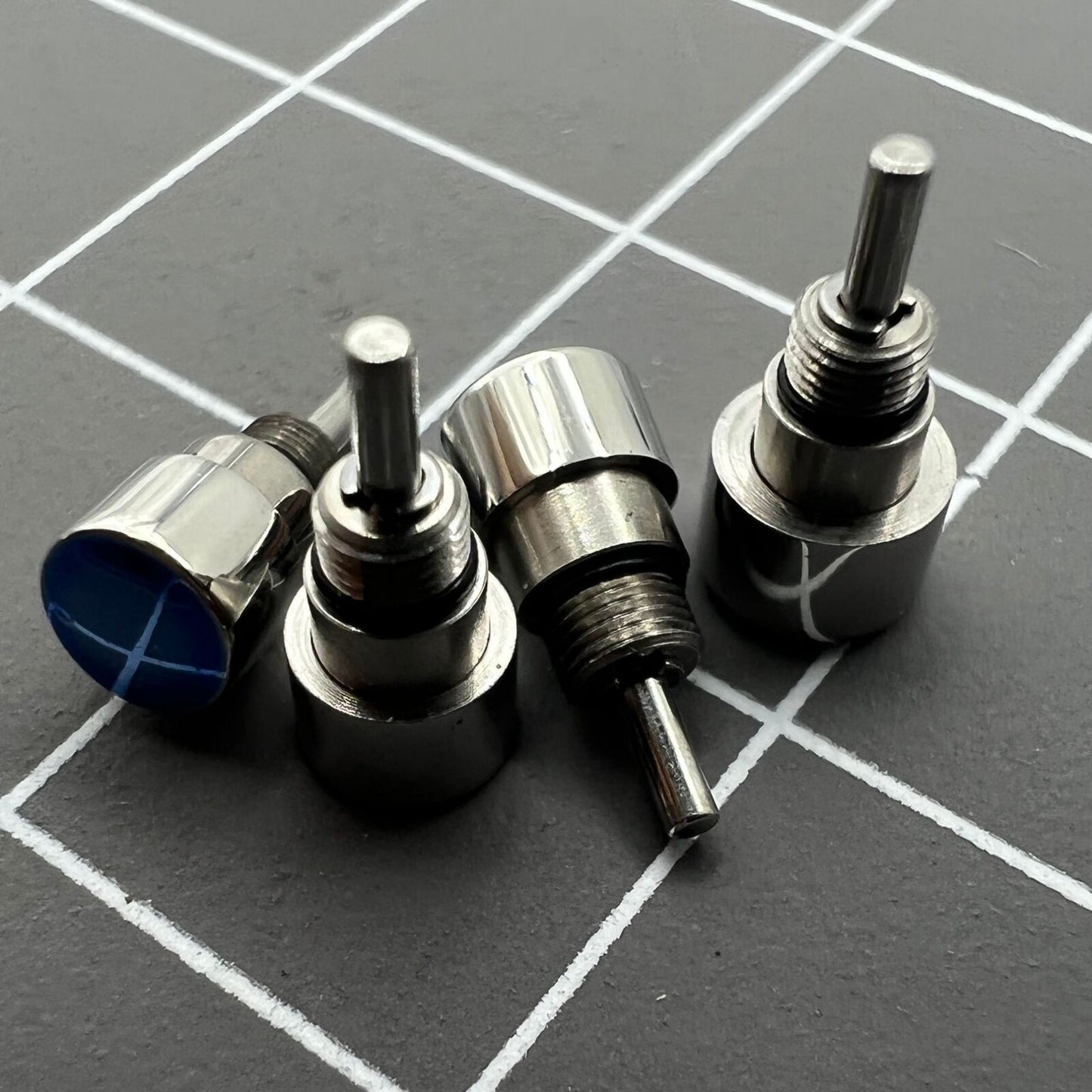 Set of 14 stainless steel watch pushers in 7 sizes, classic silver design for precise timepiece repair