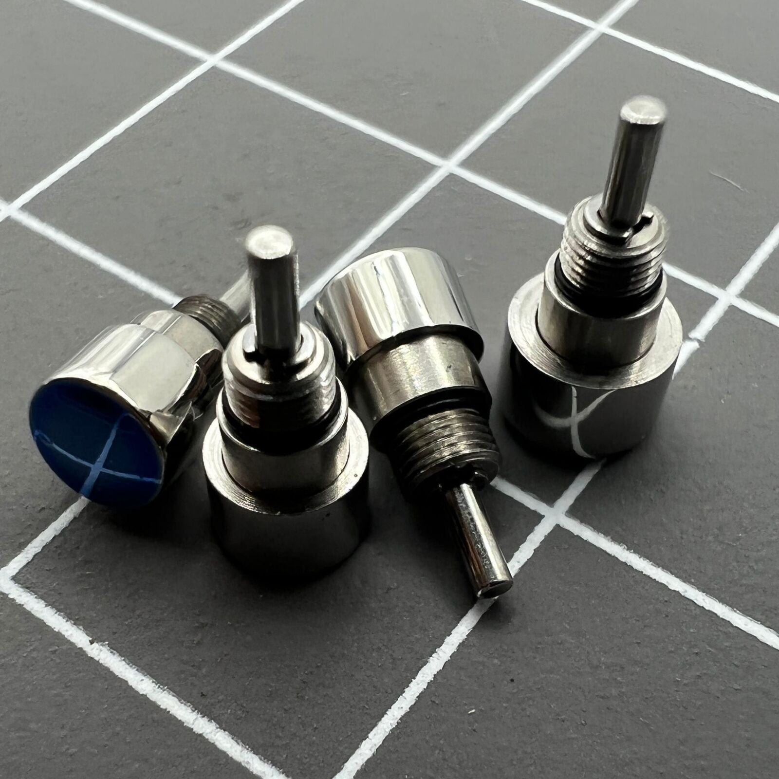 Set of 14 stainless steel watch pushers in 7 sizes, classic silver design for precise timepiece repair