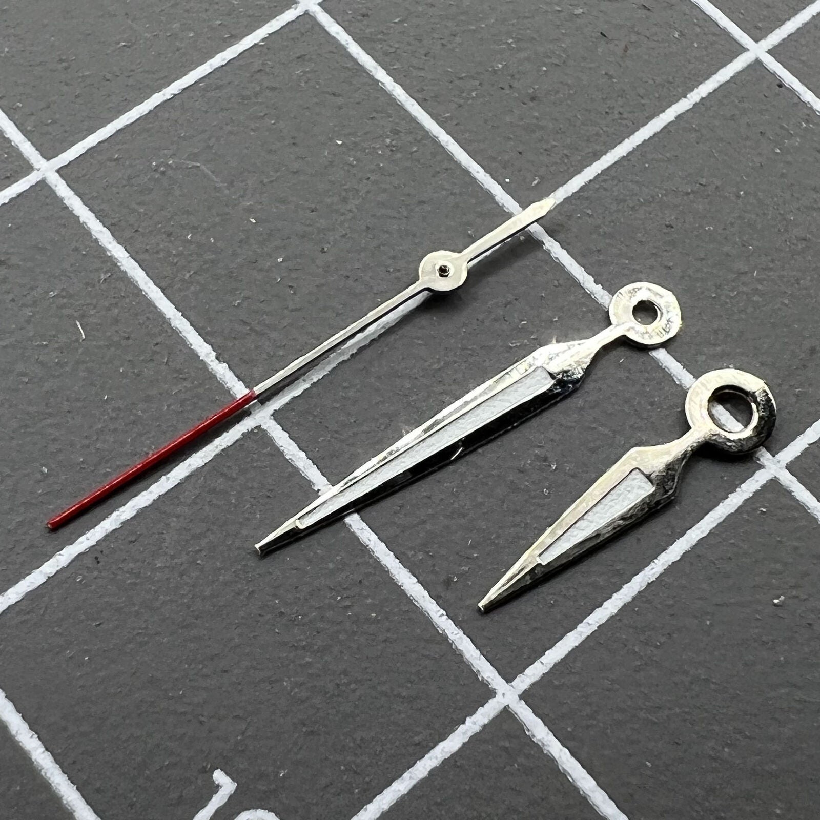 Luminous arrow-shaped watch hands for Miyota 2035, improving night-time visibility.