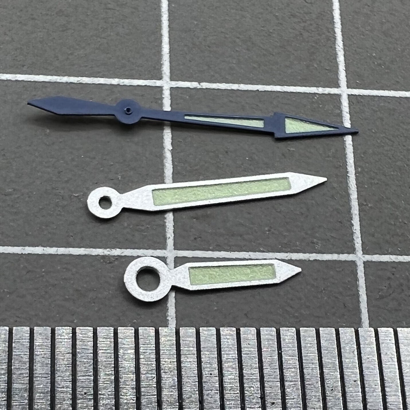 18mm silver watch hands with blue trim and green lume, Miyota 2035-2305 compatible, Butterfly brand.