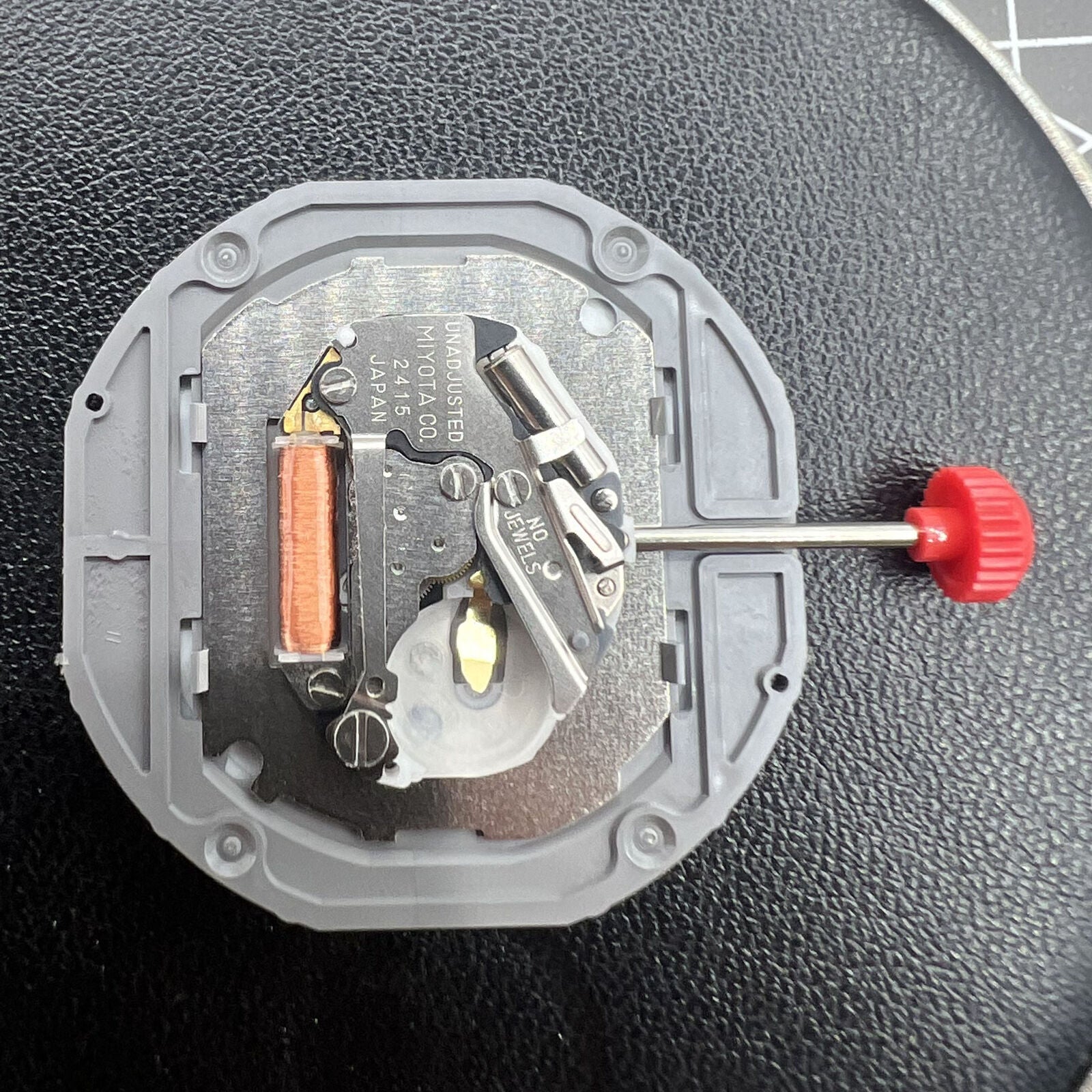 Miyota 2415 Japan Quartz watch movement with date display at 3 o'clock, precise and reliable mechanism.