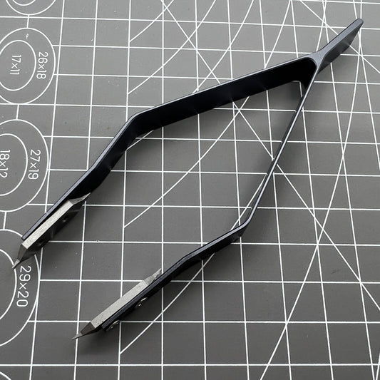 Stainless steel spring bar tweezer by 7825 for precise lug removal and watch strap fitting.