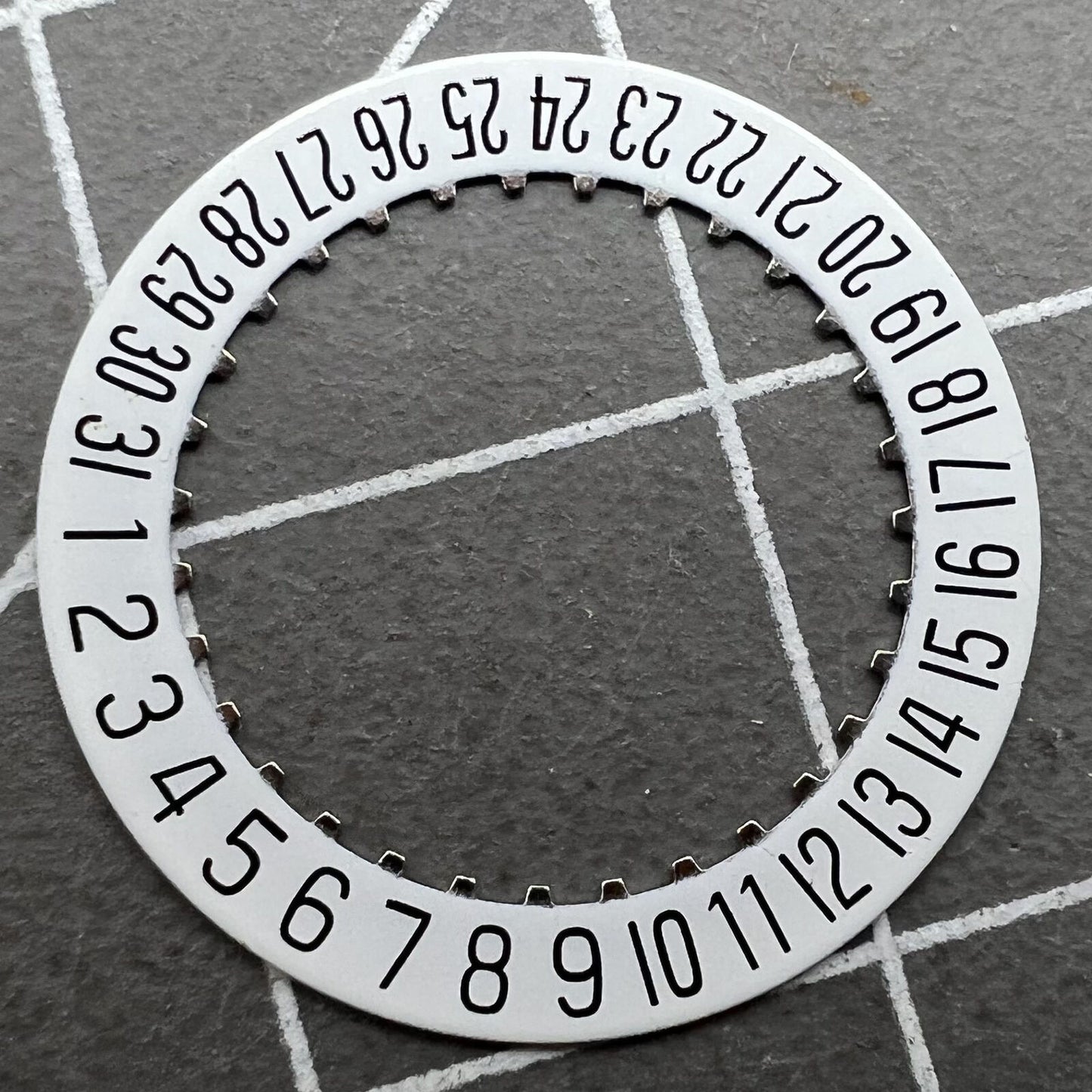 White date disk wheel for ETA 204.911 watch movement, precise fit for date function replacement.