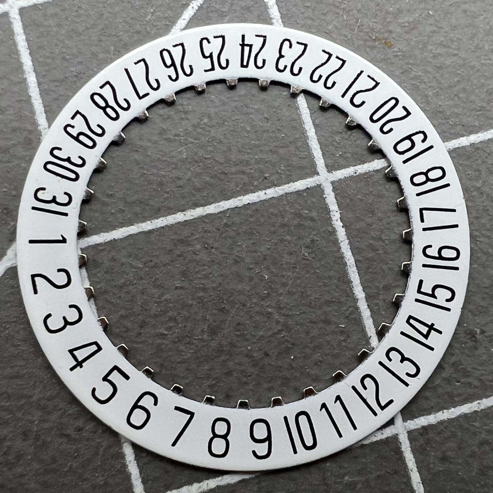 White date disk wheel for ETA 204.911 watch movement, precise fit for date function replacement.