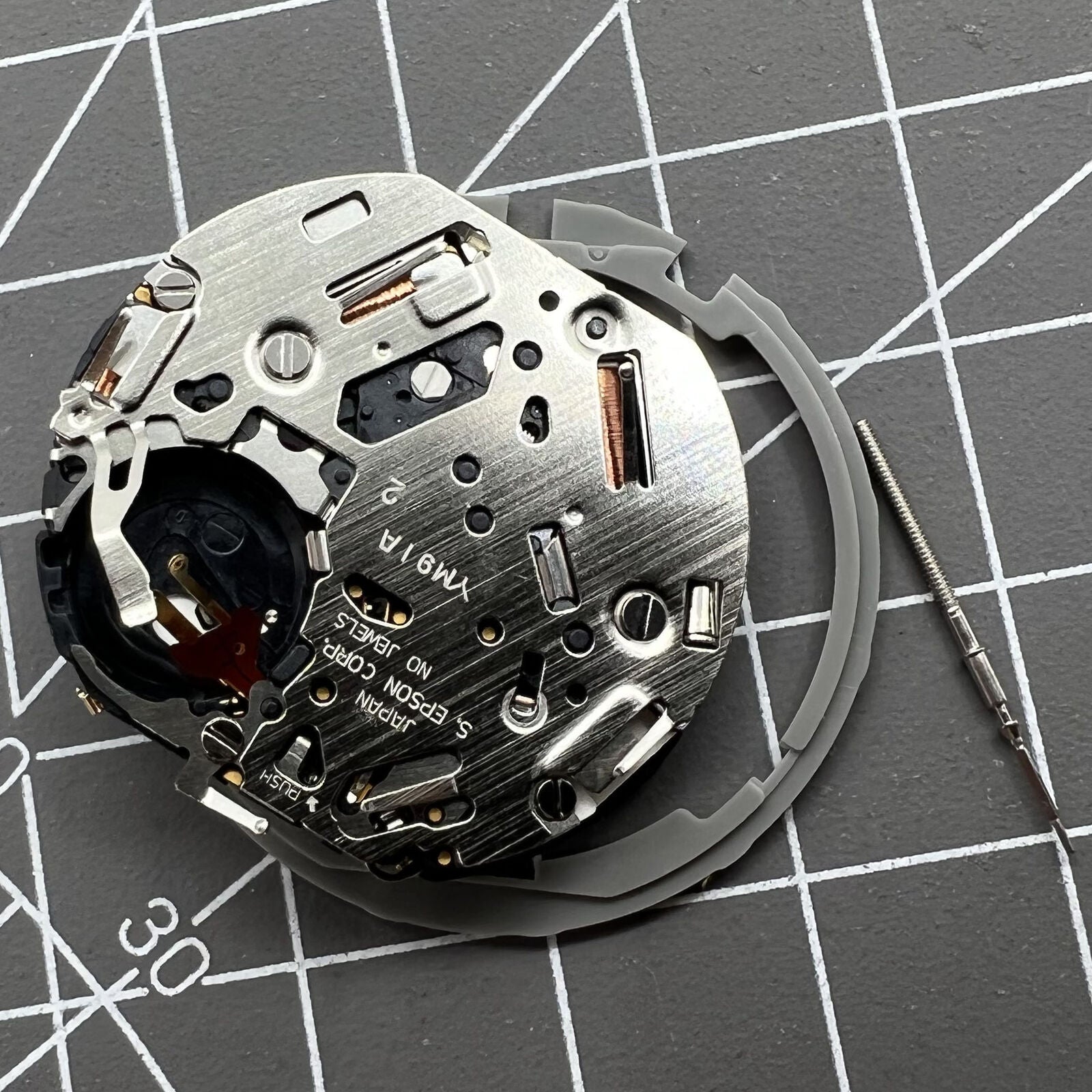 Japan Hattori Epson TMI YM91A quartz watch movement with date display at 3 o'clock, precision made