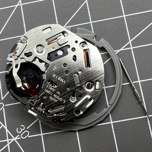 Japan Hattori Epson TMI YM91A quartz watch movement with date display at 3 o'clock, precision made