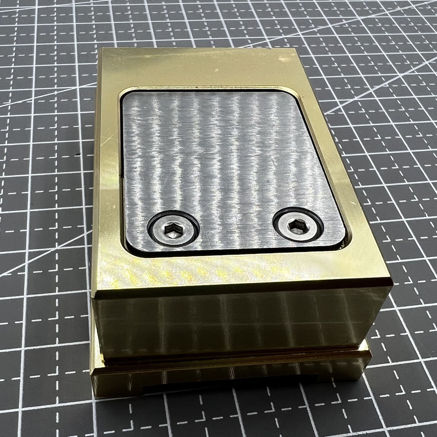 Brass-handled stainless steel pegwood tool by Woodcutter for precise watch cleaning and detailing.