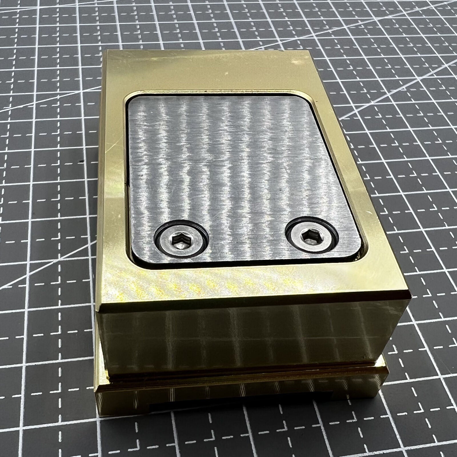 Brass-handled stainless steel pegwood tool by Woodcutter for precise watch cleaning and detailing.