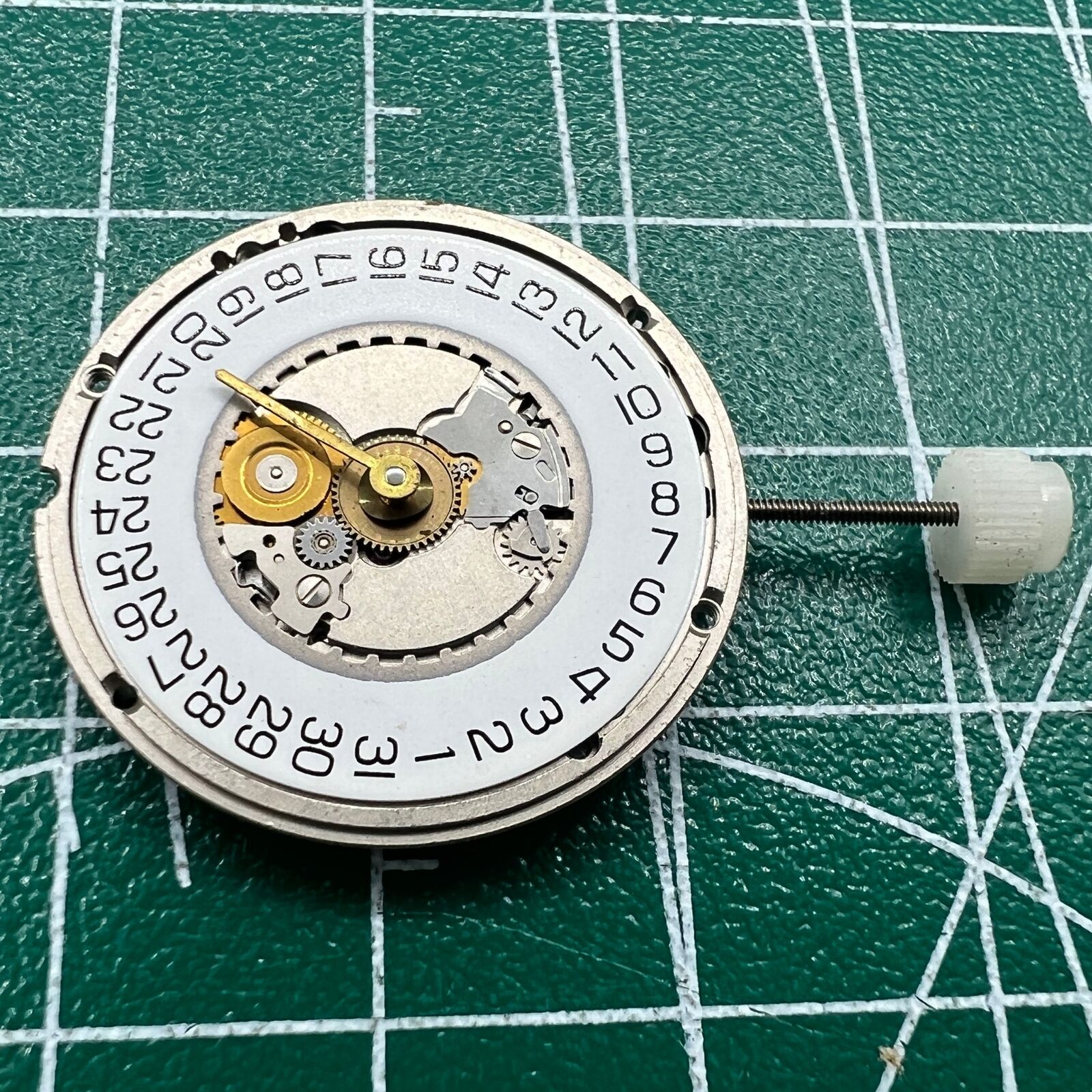 Wholesale watch accessory featuring Swiss ETA 955.414 quartz movement, silver finish, and date display at 3 o'clock.