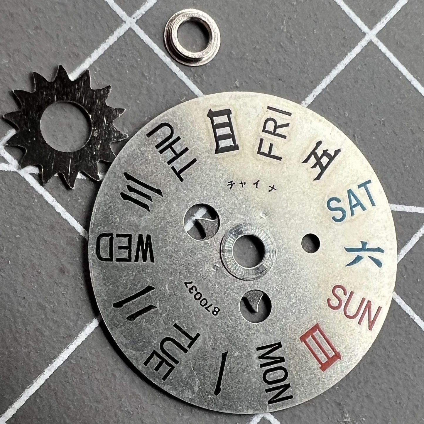 Orient watch movement showing English and Chinese week disk wheel for models 46941 and 46943, precise timekeeping component