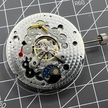 Dandong Silver watch with hollow star moon phase, automatic mechanical movement, elegant watch accessory.