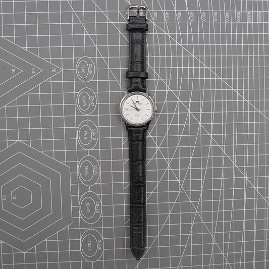 Beijing 31mm manual mechanical watch with silver case and double rhomb dial, classic Chinese craftsmanship.