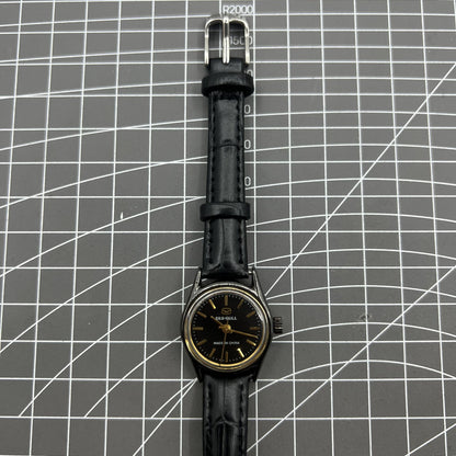 27mm Tianjin Seagull ladies watch with manual mechanical movement and golden nail hour markers.