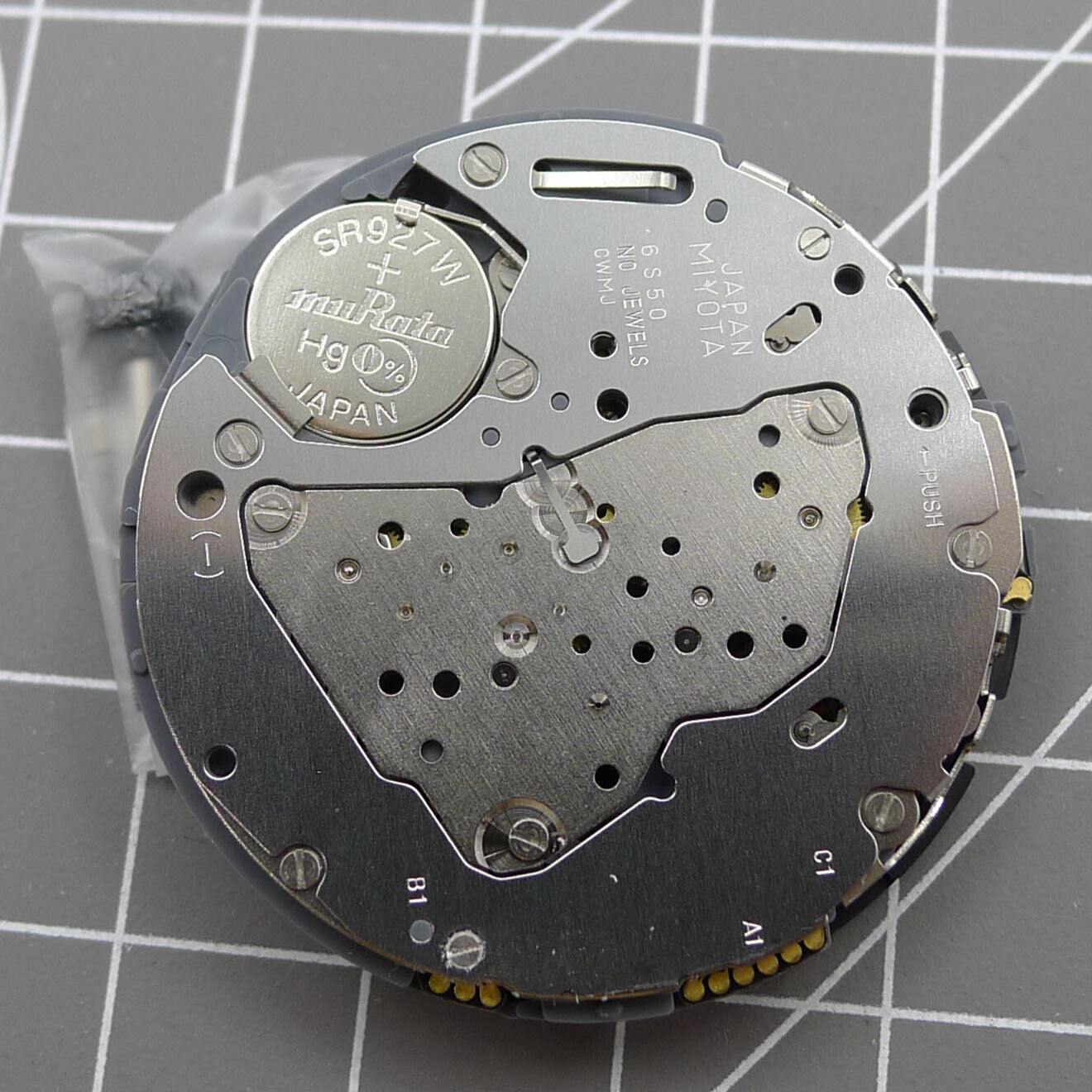 Miyota 6S50 quartz watch movement with date at 12 and small seconds at 3, 6, 9 positions for precision timekeeping