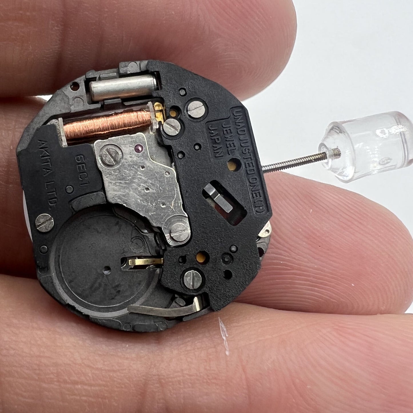 6EC1 quartz watch movement with date at 3 o'clock, Japan-made for accurate watch repairs.