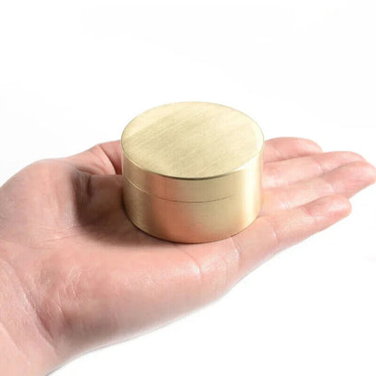 Steel and copper watch oil cylinder for precision watch repair and maintenance tasks.