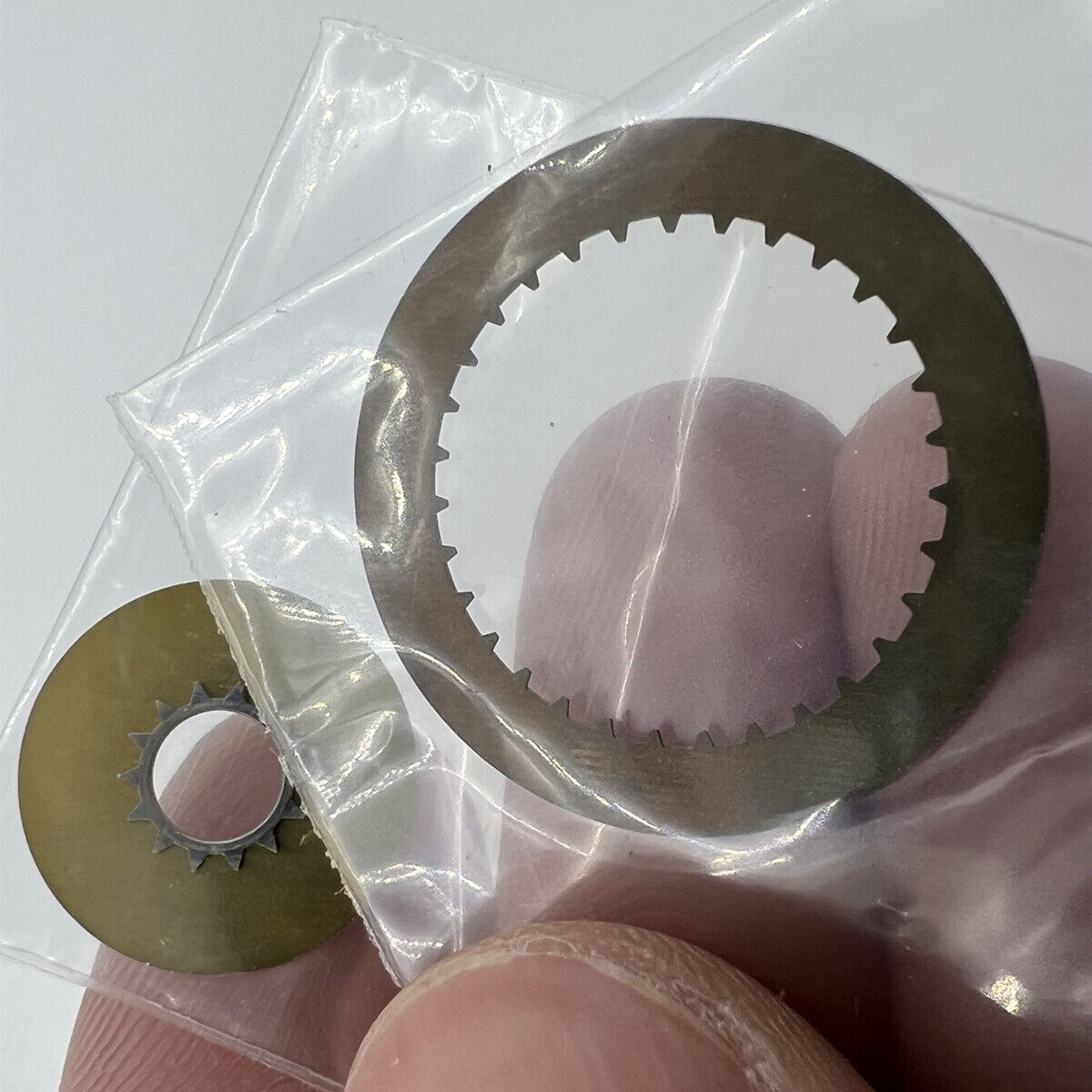 White date disk wheel showing date numbers, genuine ETA7750 movement part for watch repair.