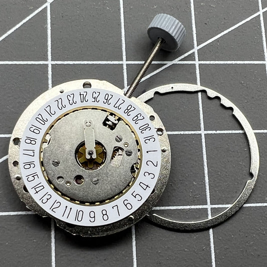 Swiss Ronda 785 quartz watch movement with date at 6, precision three-hand design for watch accessories.