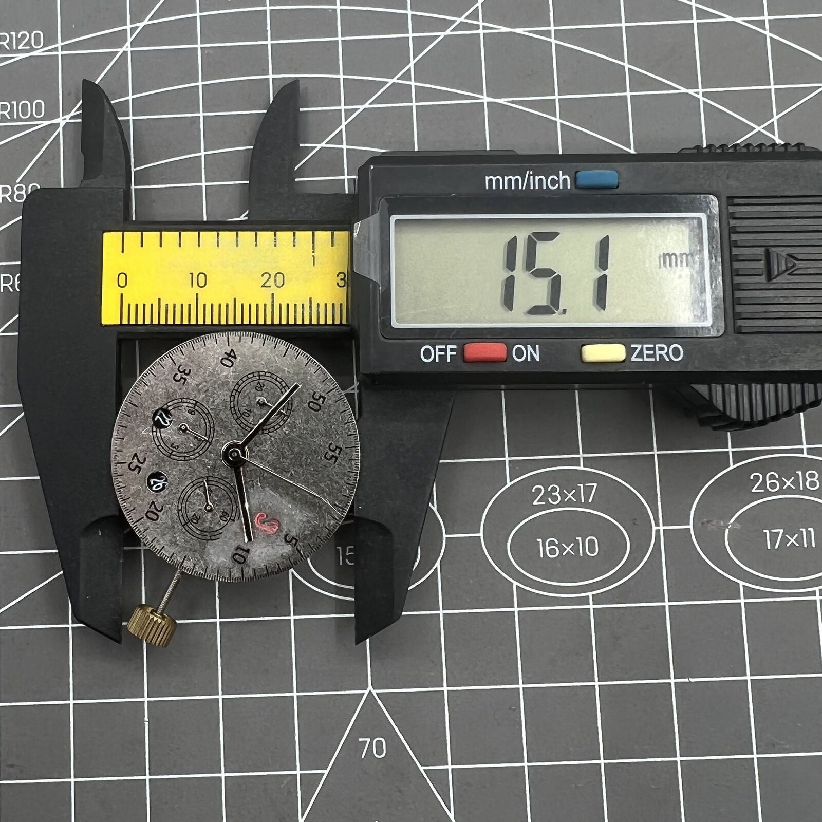 Dandong 7750 mechanical watch movement with black dial, small seconds at 6 o'clock, date window, precise timekeeping.