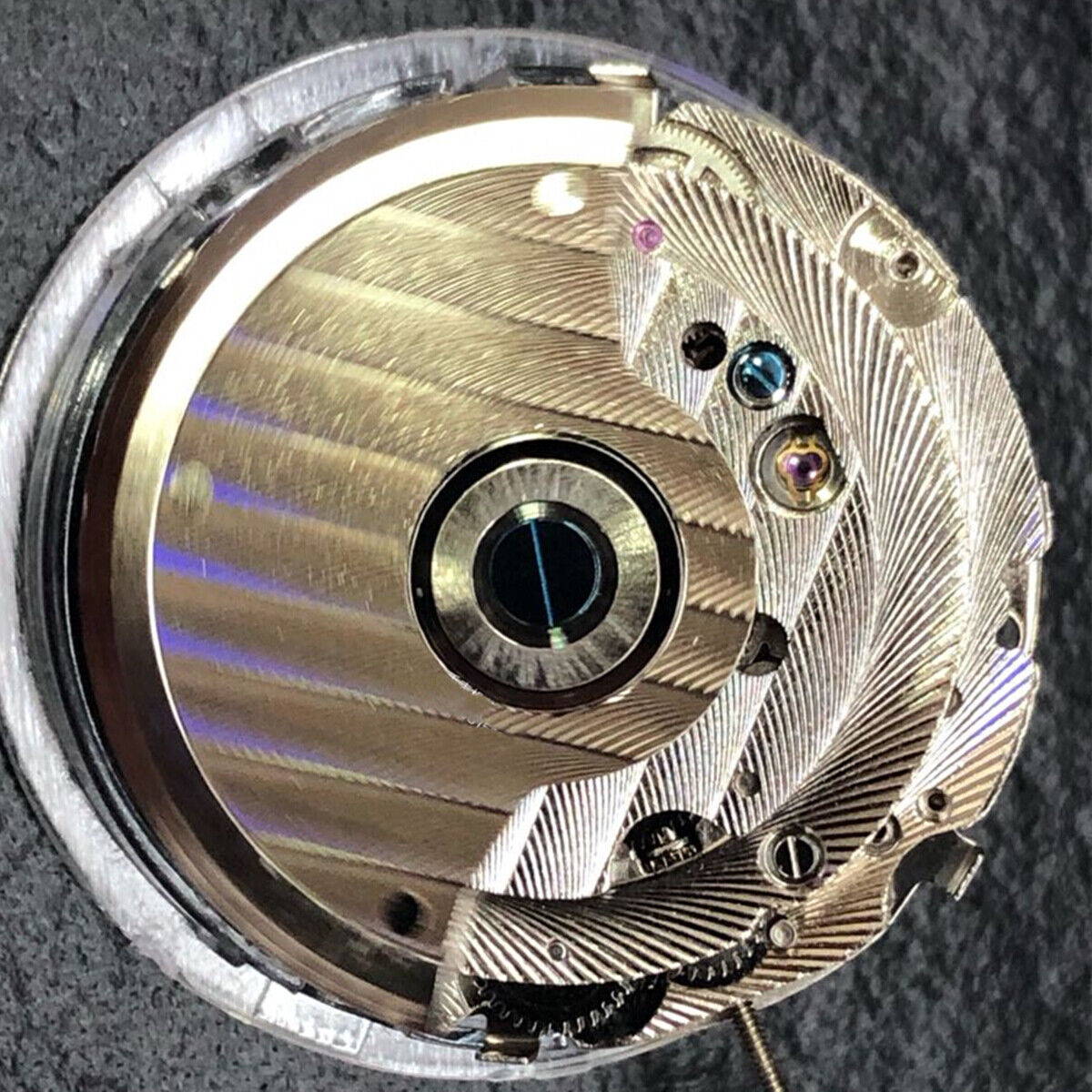 China Made automatic watch with mechanical movement, reversed balance wheel, big date at 12, elegant design.