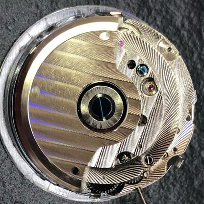 China Made automatic watch with mechanical movement, reversed balance wheel, big date at 12, elegant design.