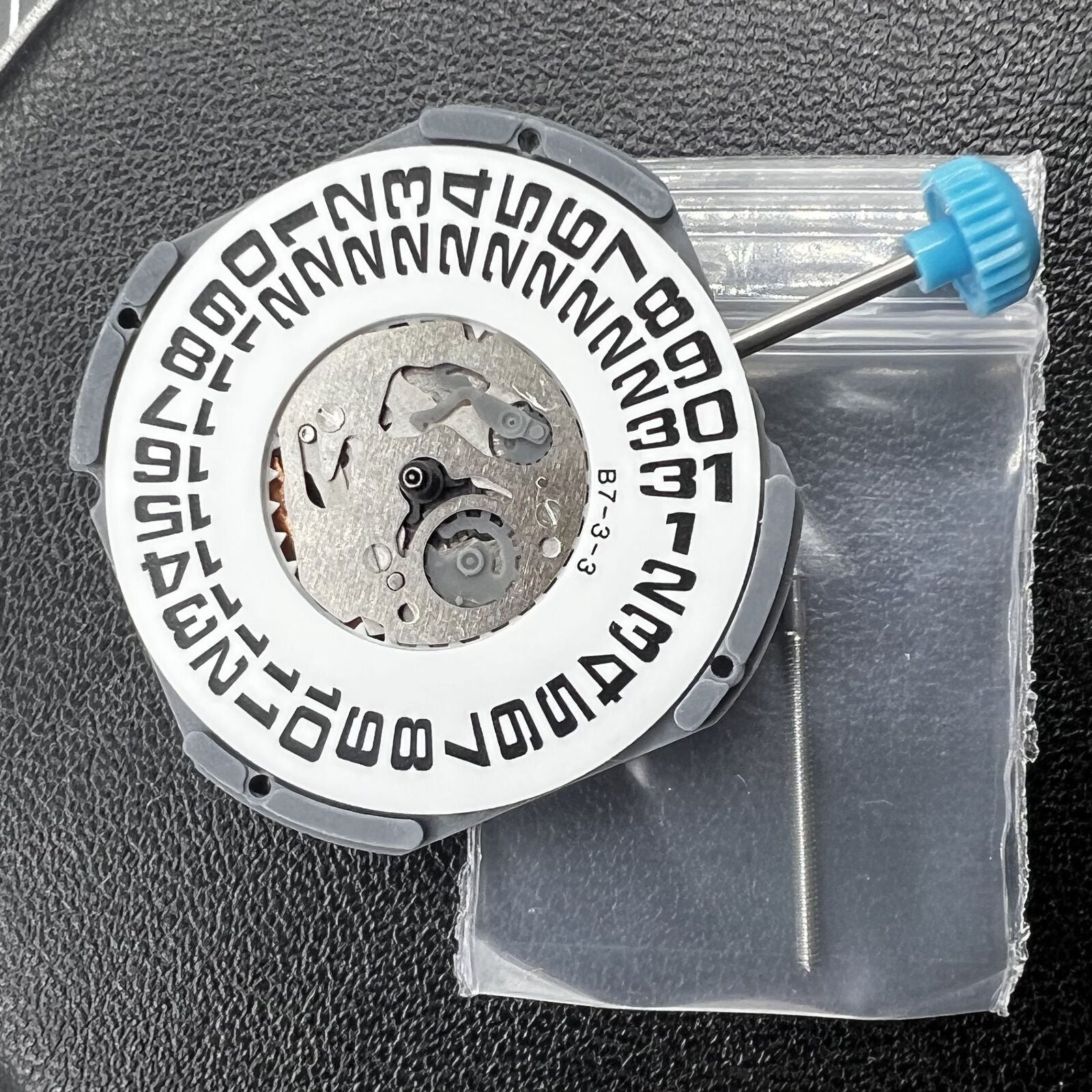 Miyota 6M53 quartz watch movement with large date display at 3 o'clock and three-hand design for accuracy.