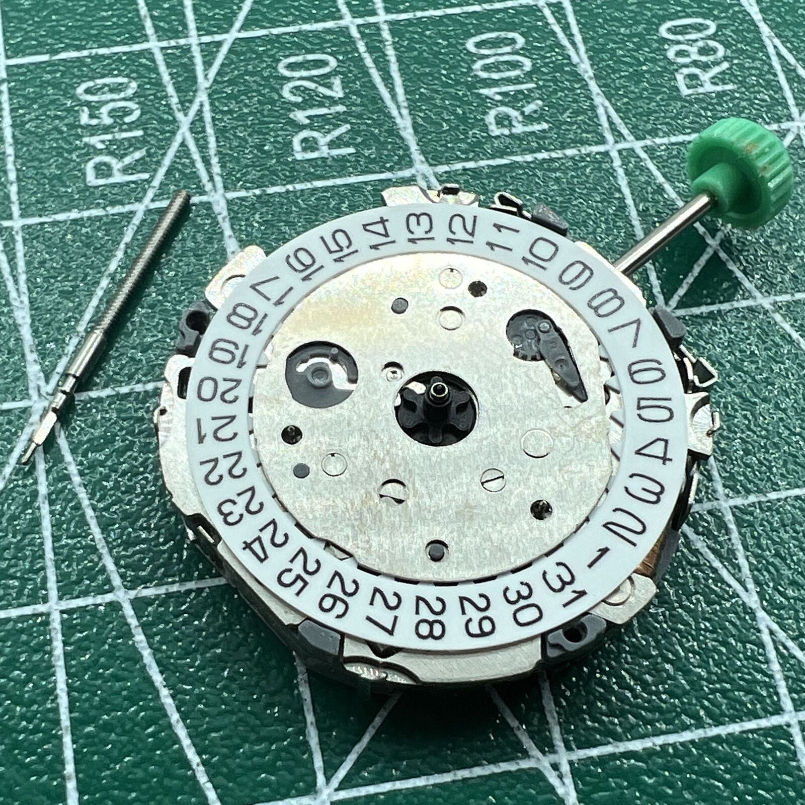 Japan Miyota FS01 quartz watch movement for precise timekeeping in watch repairs and assembly.