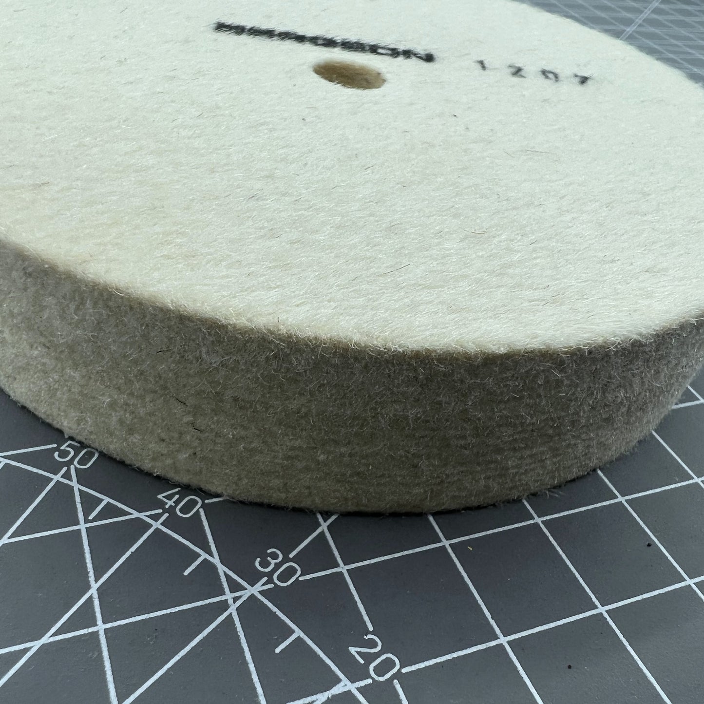 Swiss Bergeon 1207 white felt polishing wheel for precise watch accessory finishing and polishing.