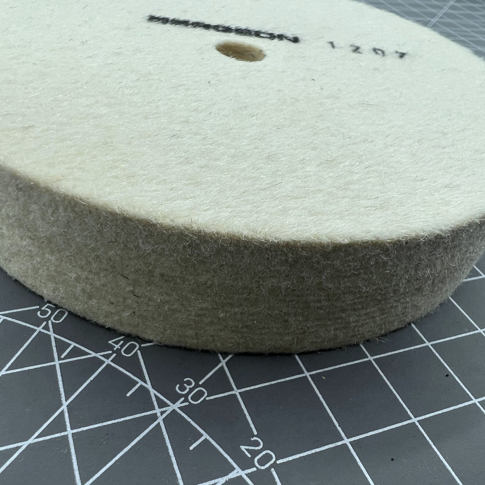 Swiss Bergeon 1207 white felt polishing wheel for precise watch accessory finishing and polishing.