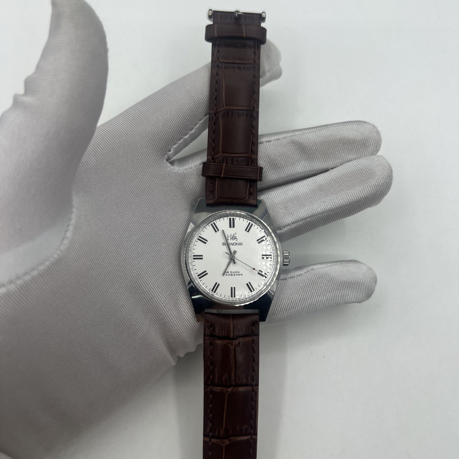Shanghai Factory 38mm manual mechanical watch with white dial, 3 hands, 19 jewels for precise timekeeping and classic style.
