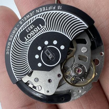 Tissot ETA C01.211 chronograph watch movement with black dial, precision mechanical accessory for watch repairs.