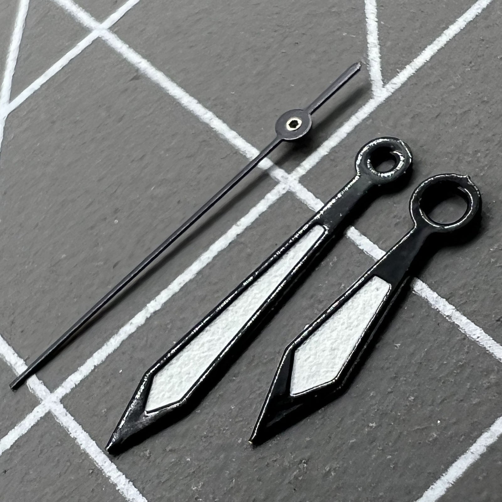 1. Two sets of 12mm black-trimmed white hands for Ronda 515 quartz watches.  