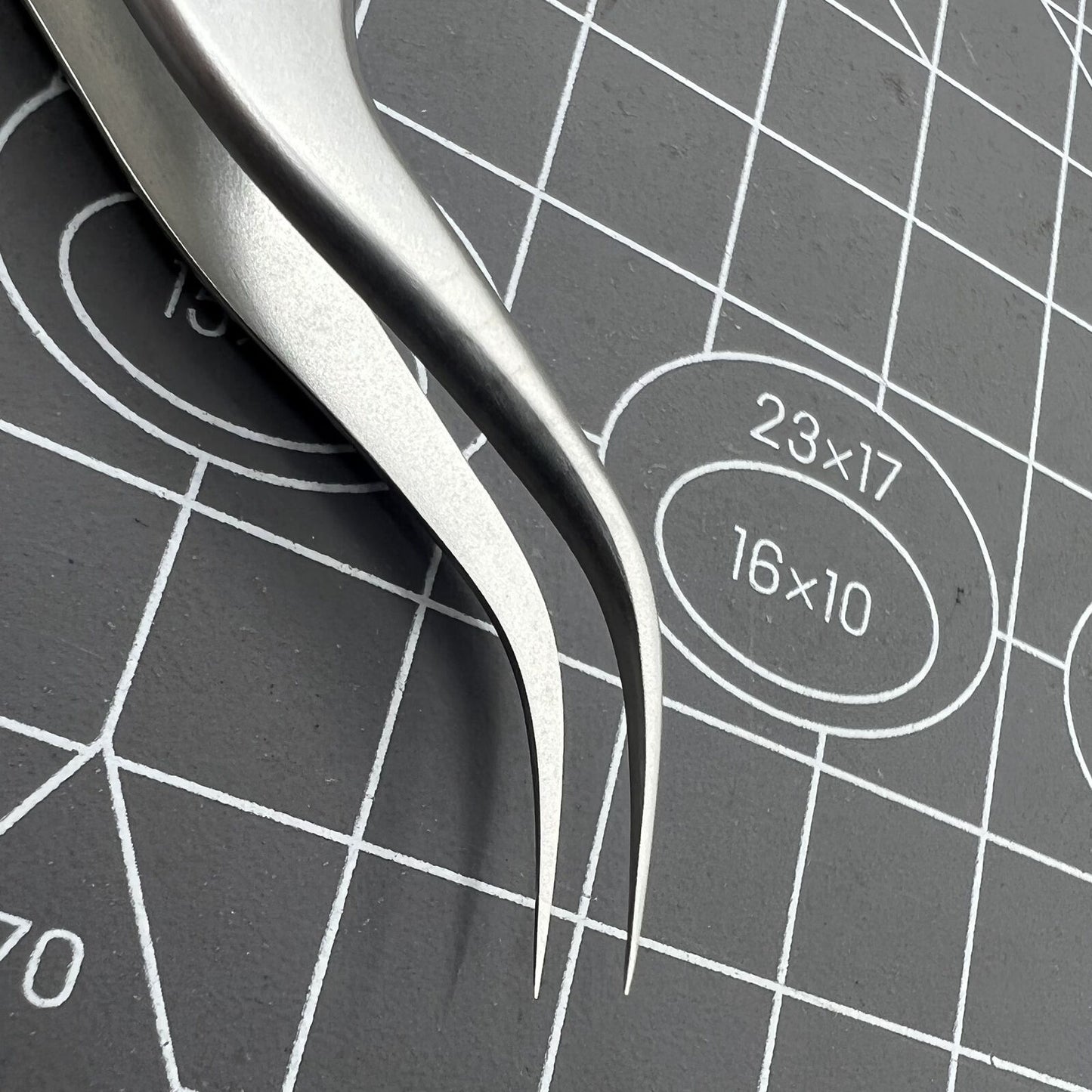 Swiss Bergeon 7026-7 antimagnetic tweezers with fine curved tips for precise watch accessory adjustments.