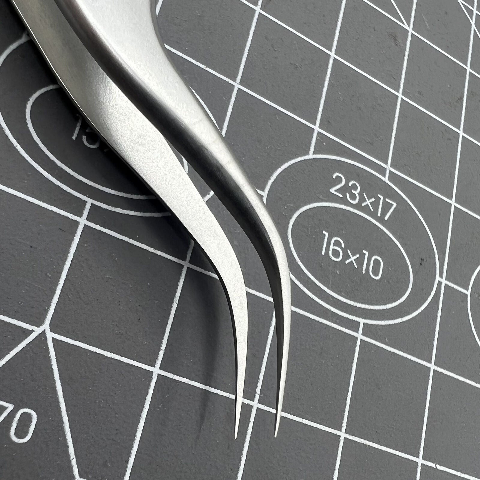 Swiss Bergeon 7026-7 antimagnetic tweezers with fine curved tips for precise watch accessory adjustments.