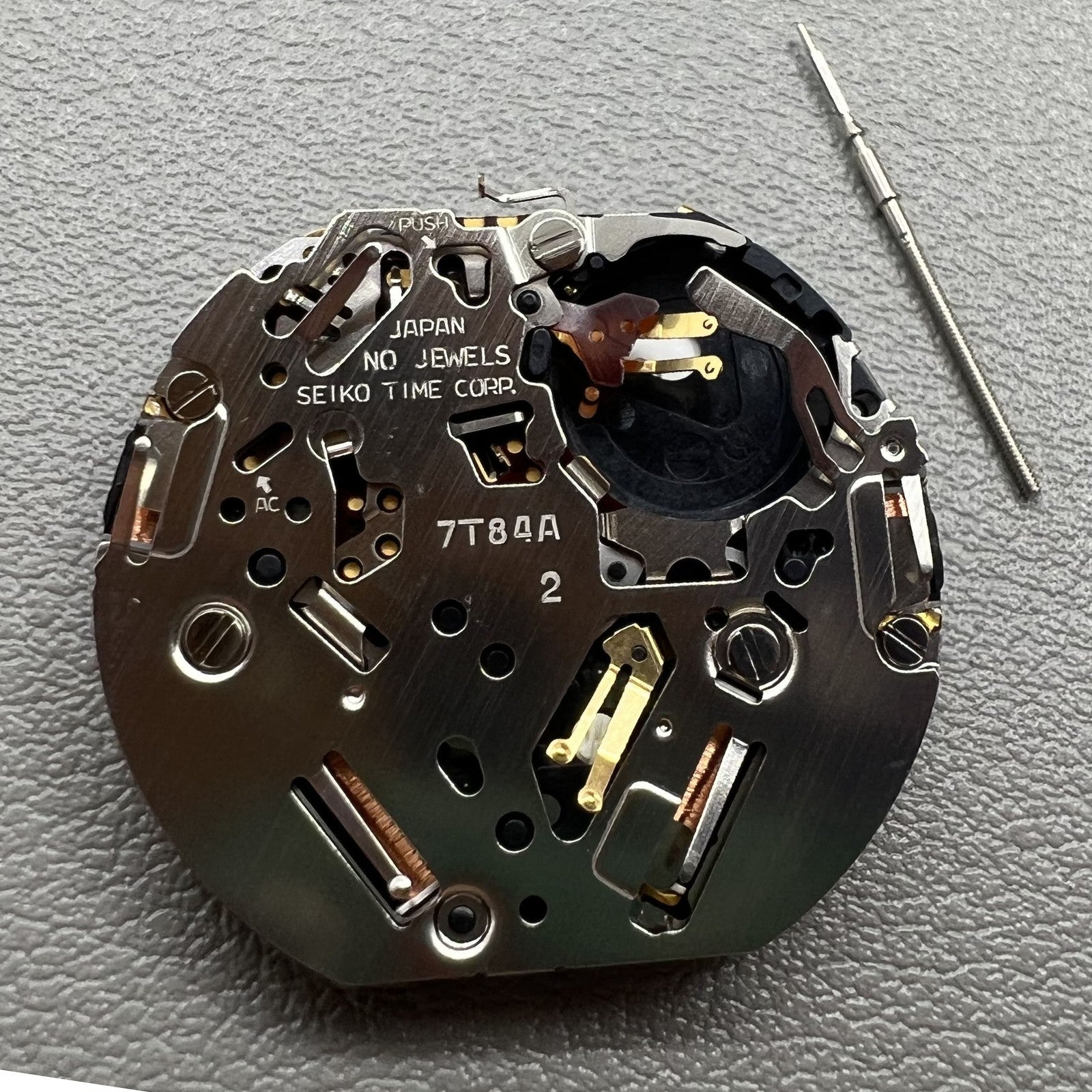 Japan Seiko 7T84A Quartz watch movement featuring precise chronograph functions for accurate timekeeping and durability.