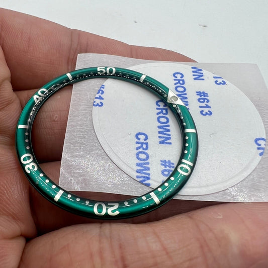 Dark green and white font aluminum bezel insert for 39mm watch, circular arc bevel design, premium accessory.
