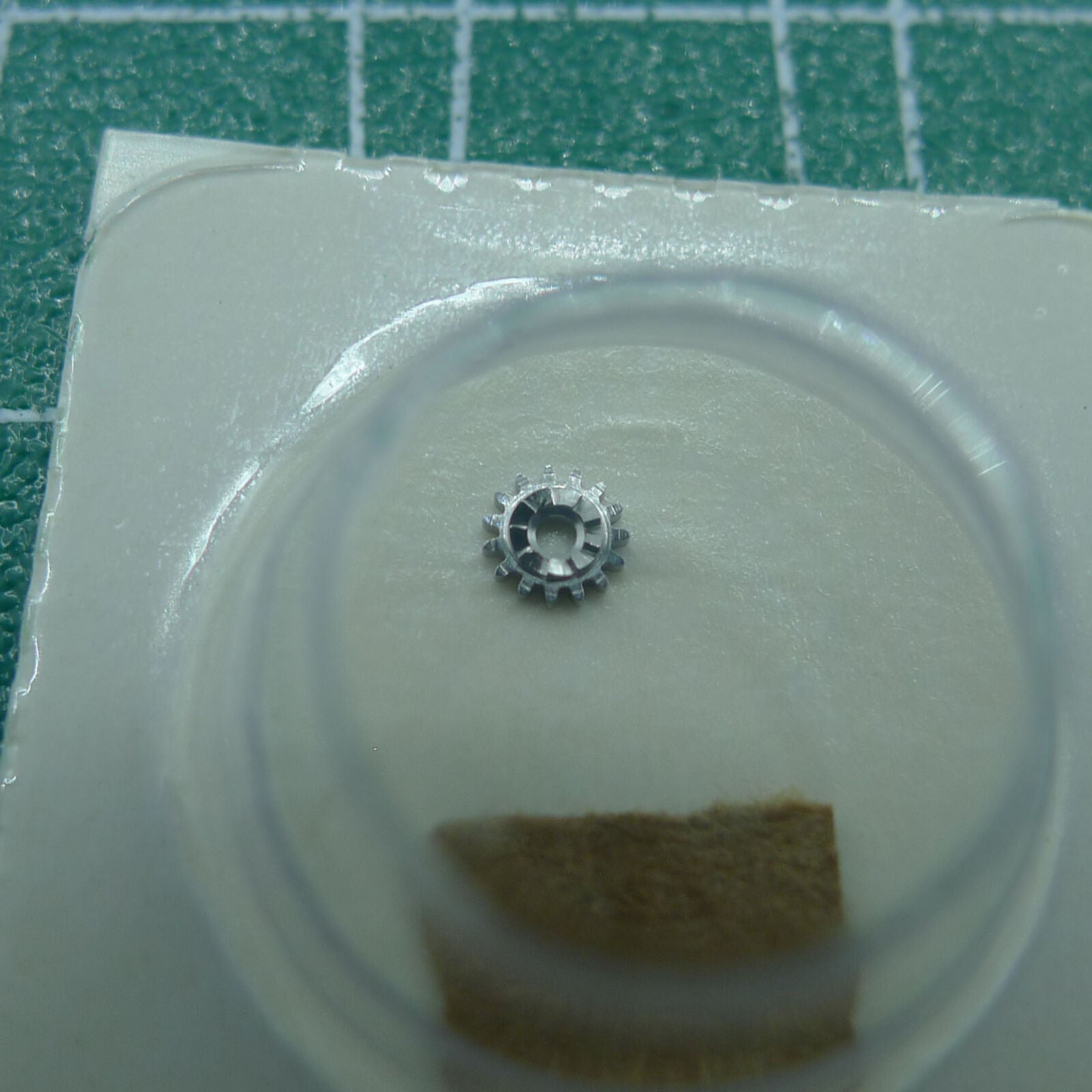 Wholesale winding pinion for 1530 1570 watch movements, generic replacement part for precise timekeeping.