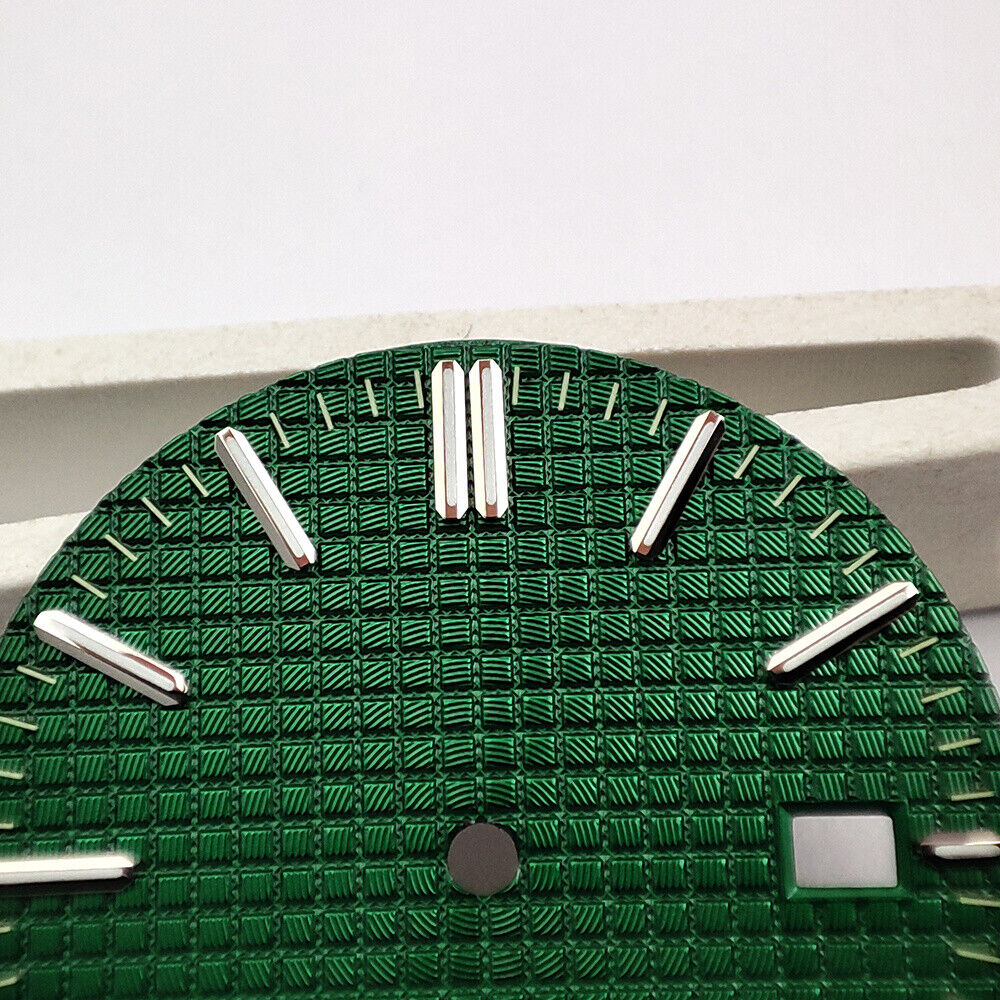 Green lume watch dial with silver trim and nail markers, featuring green check pattern for NH35 movement.