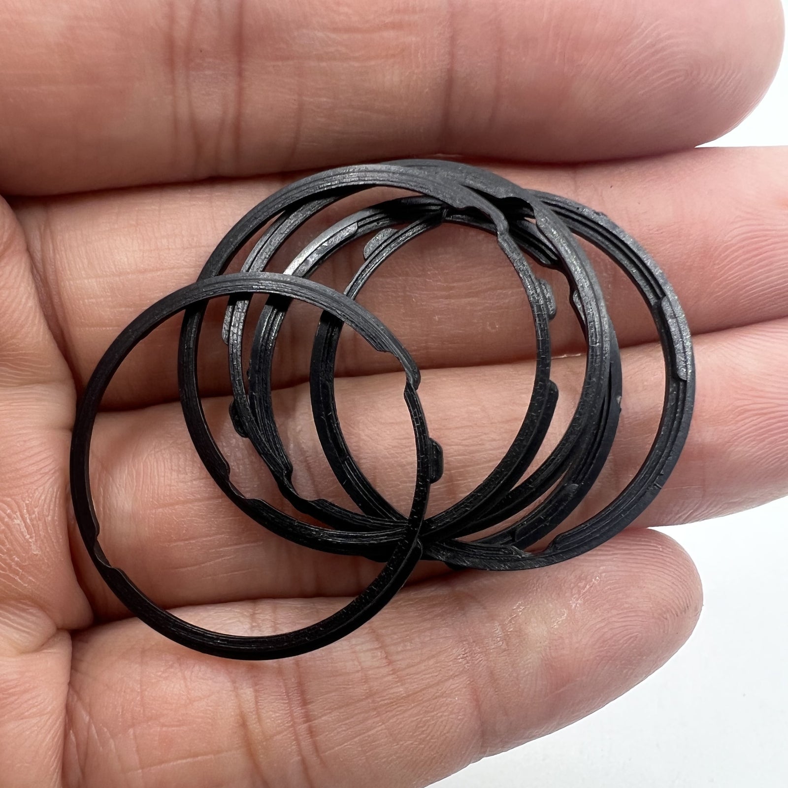 Black cushion mount spacer ring for Orient 46941 movement, securing watch dial fit precisely.