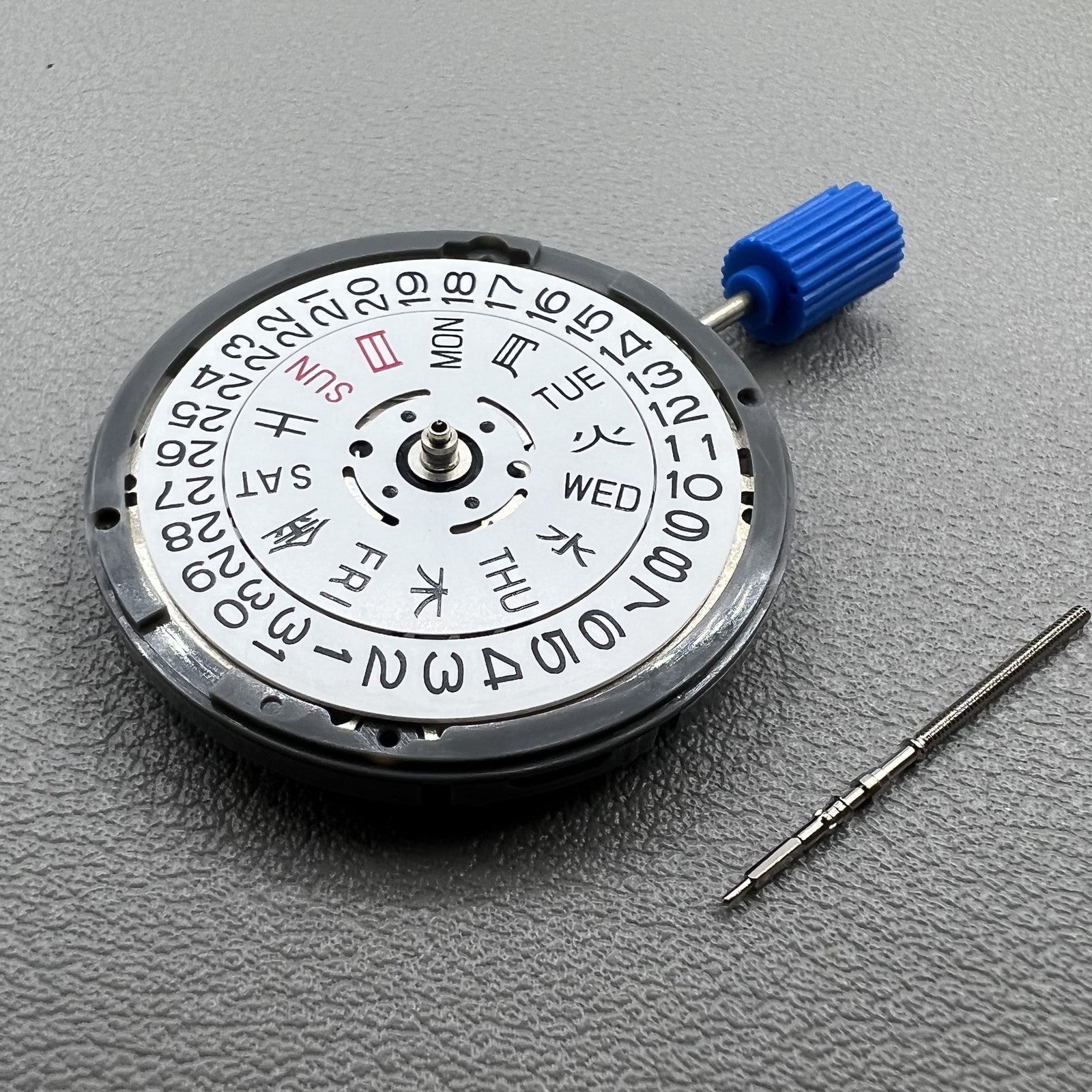 Seiko NH36 watch movement with white dial, bilingual Japanese-English day display, 3.8mm crown, reliable precision.