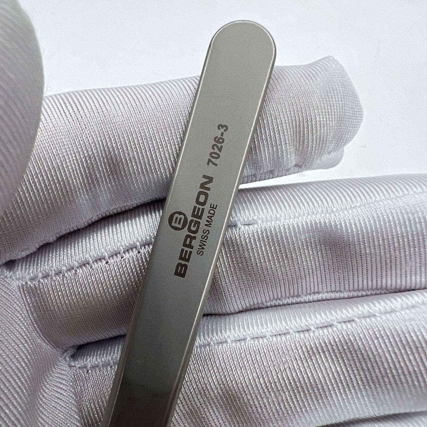 Swiss Bergeon antimagnetic fine hairspring tweezers model 7026-3 for precise watch repair.