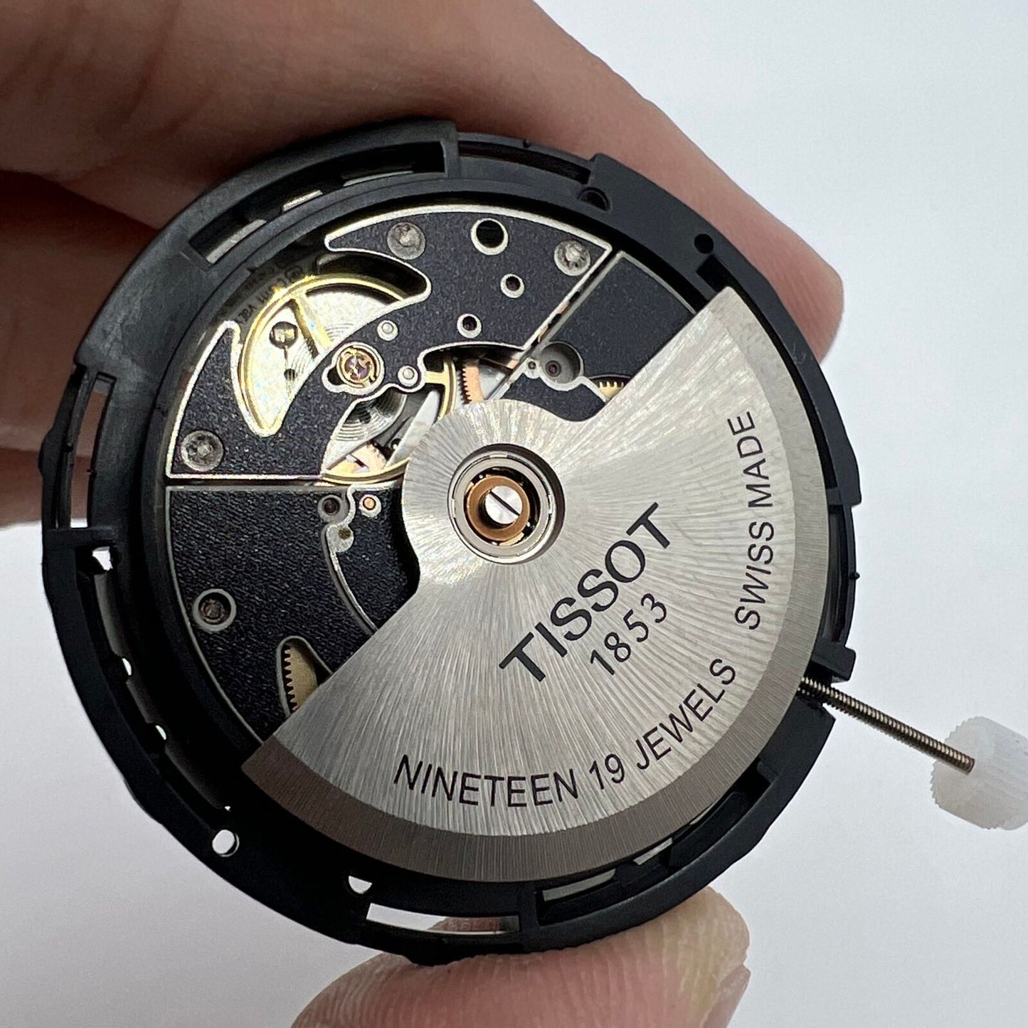 ETA C15.111 chronograph mechanical watch movement with white dial by Tissot, Swiss made precision.