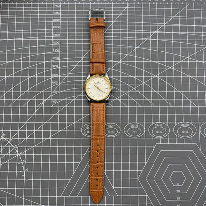 38mm TAIHANG mechanical watch with golden nails, silver dial, and round case featuring 17 jewel movement.