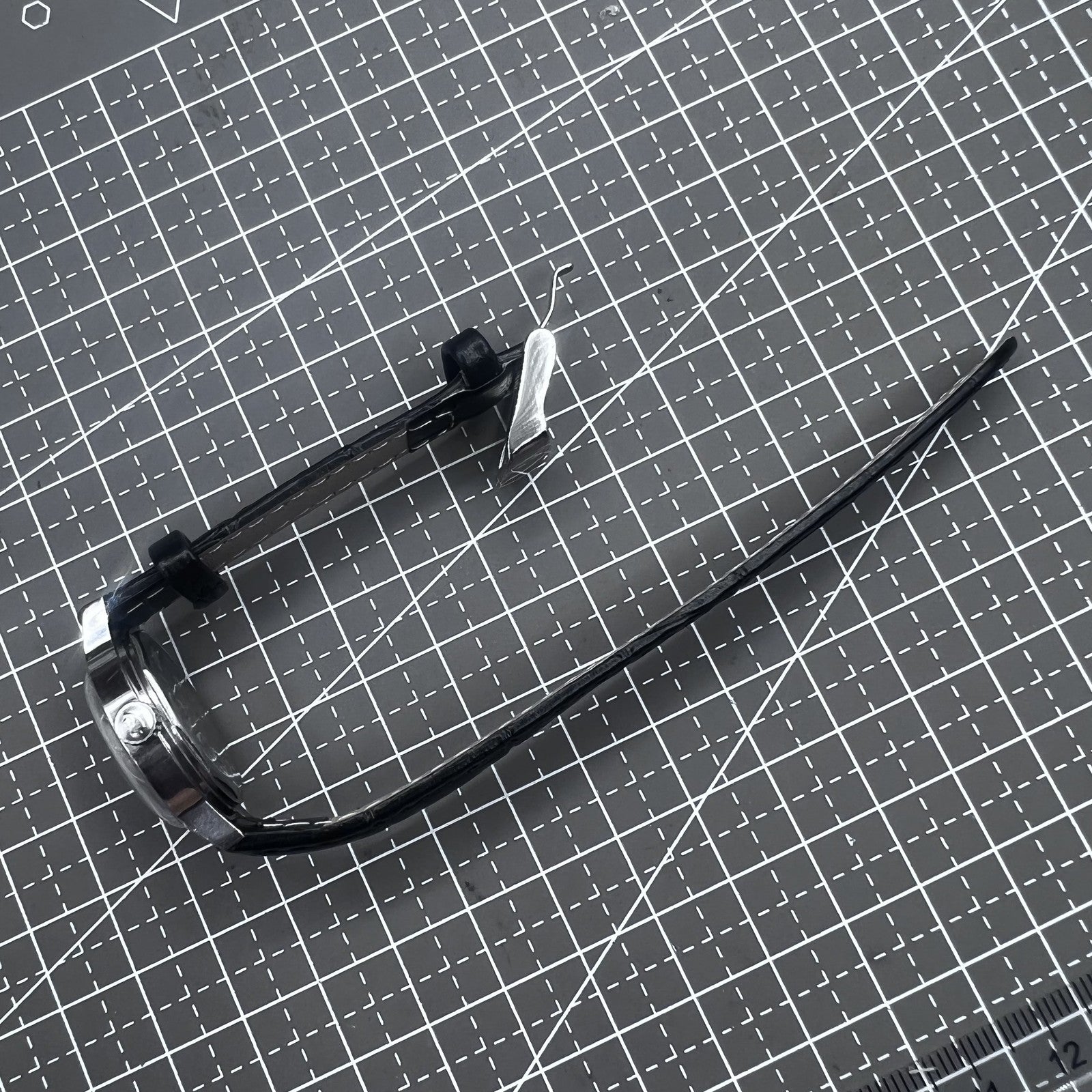 27mm Kongque watch with black leather strap, silver dial, gold markers, and manual mechanical movement.